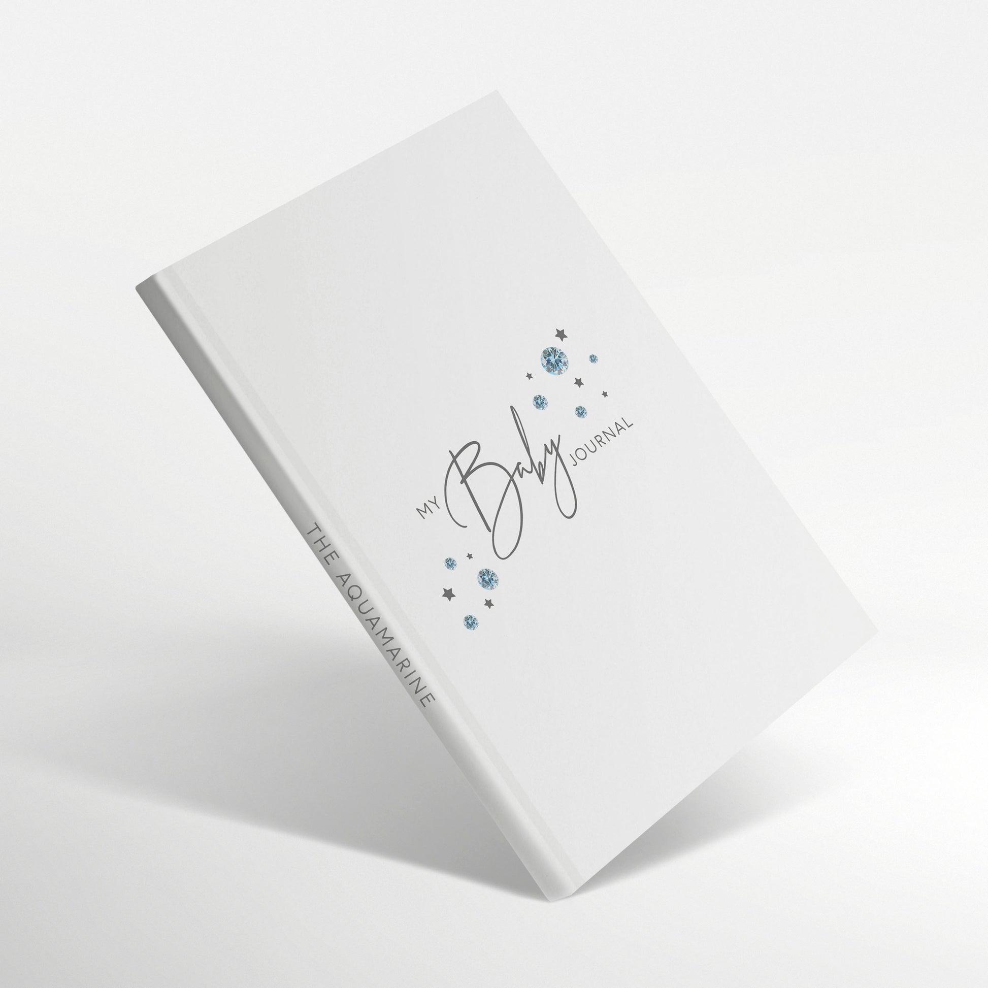 White baby journal with aquamarine birthstone illustration on the cover