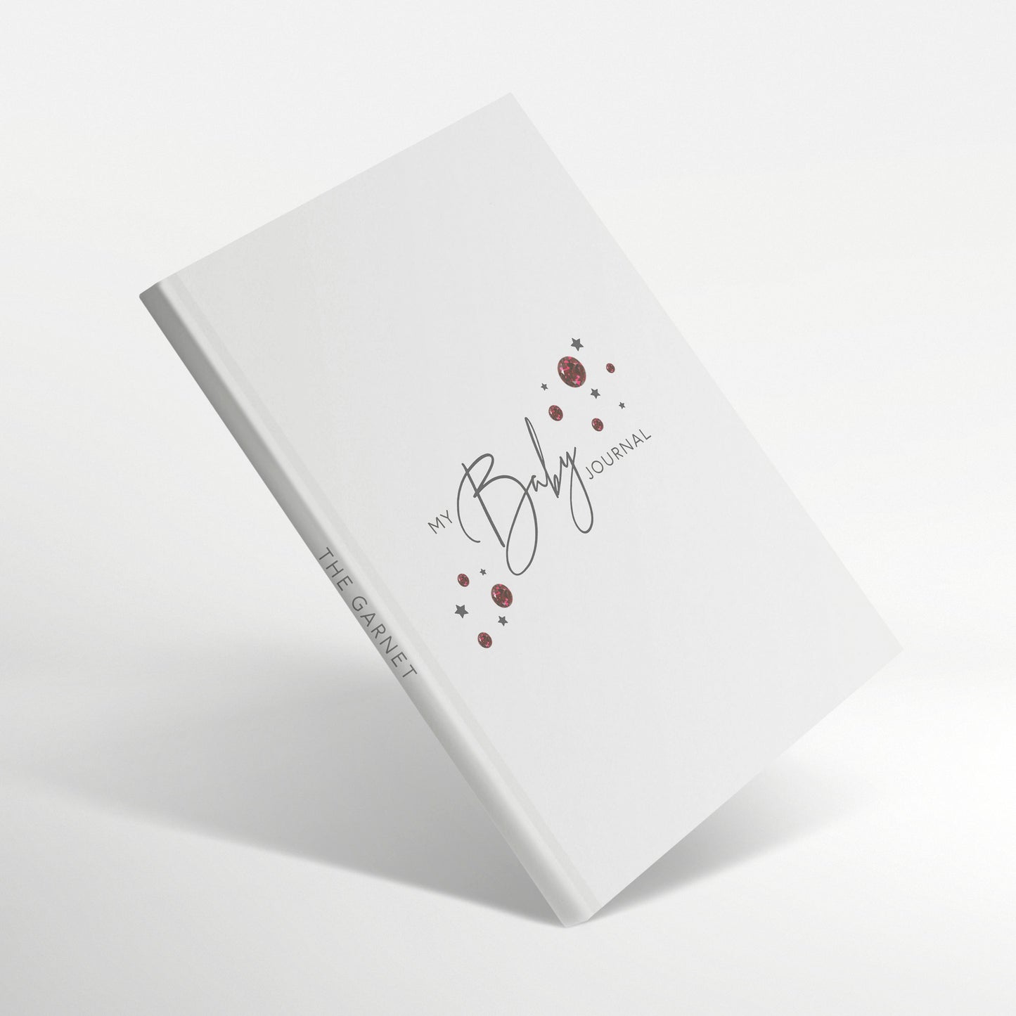 White baby journal with garnet birthstone design and 'The Garnet' spine title