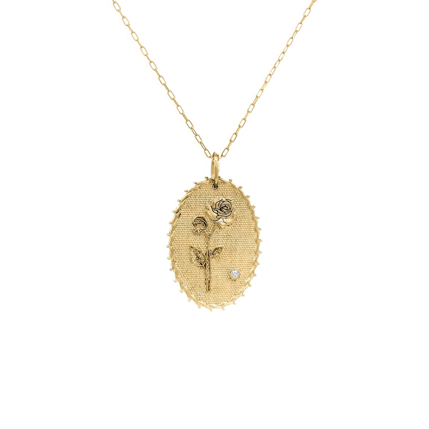Gold necklace with a pendant featuring a floral design on a white background