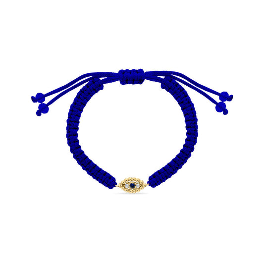 Adjustable royal blue cord bracelet featuring an 18k gold evil eye charm set with a central sapphire and surrounded by diamonds.