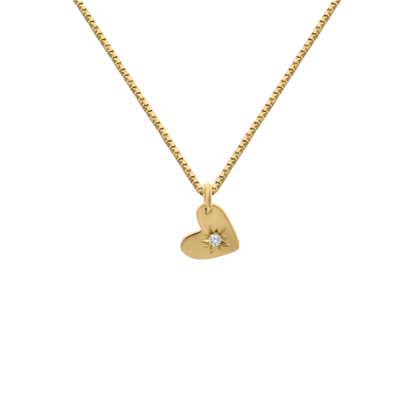 A studio shot of a delicate 18K yellow-gold heart pendant featuring a starburst engraving set with a single round brilliant-cut diamond, suspended from a fine paper-clip chain on a transparent background.