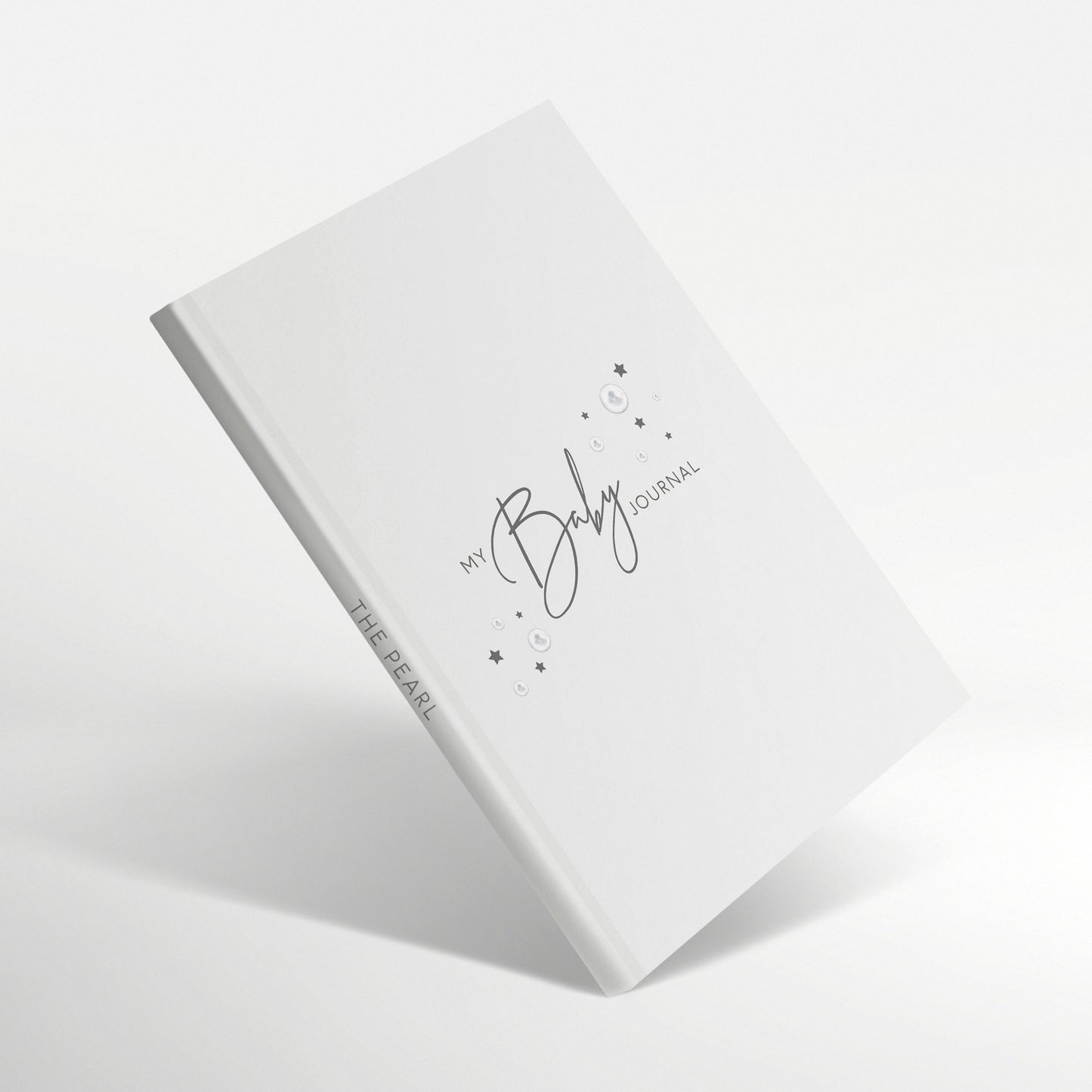 White baby journal with birthstone and star illustrations, titled “My Baby Journal – The Pearl”.
