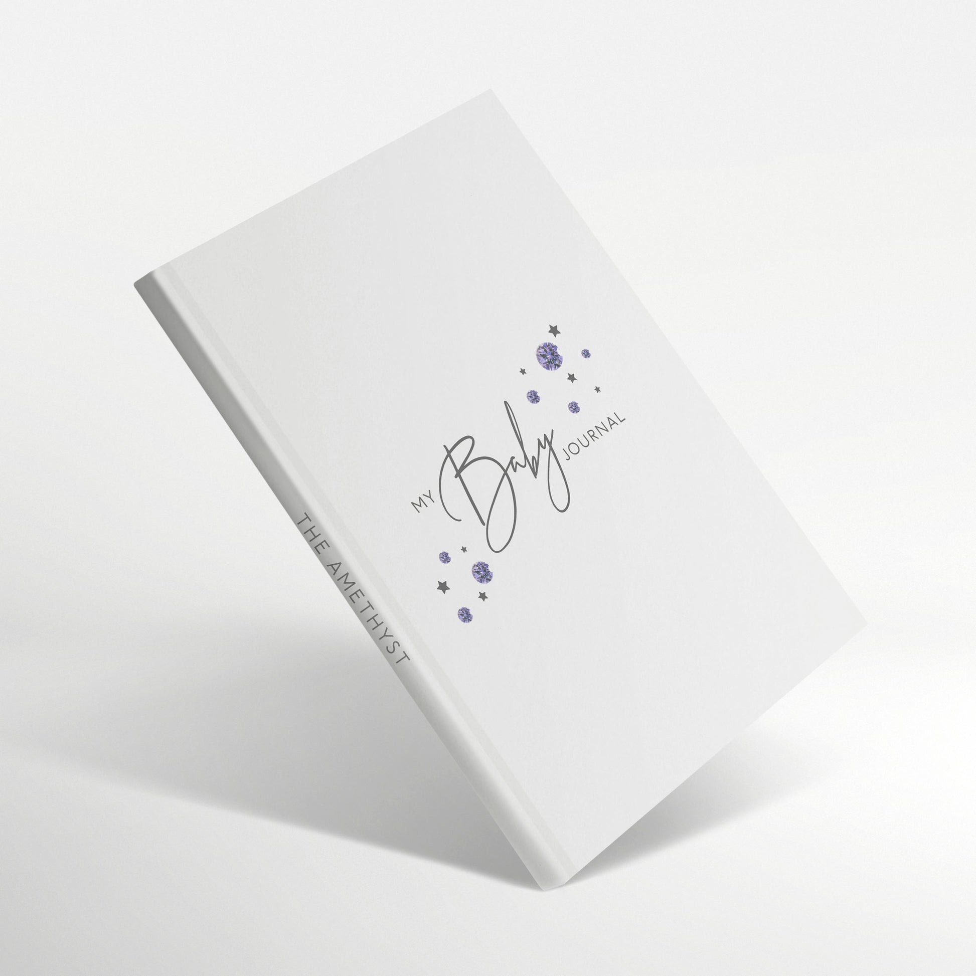 White baby journal with purple amethyst birthstones on cover.