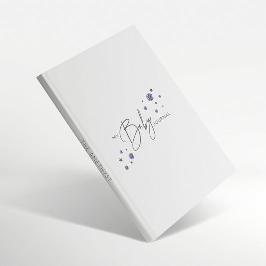 White baby journal with purple amethyst birthstones on cover.