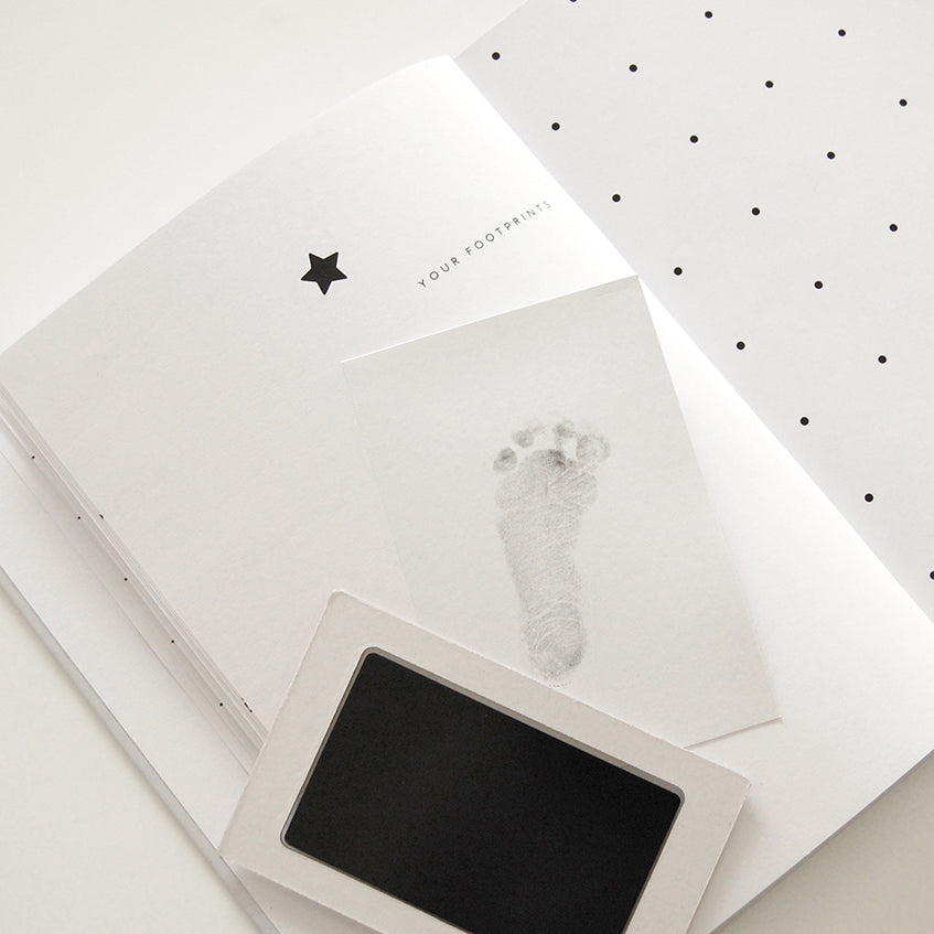 Baby journal footprint page with ink pad.