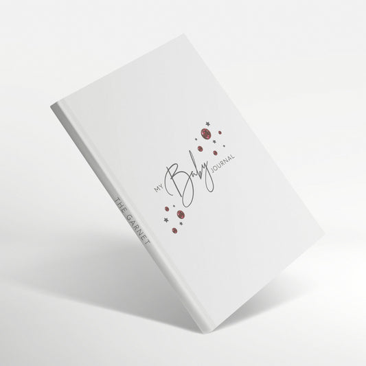 White baby journal with garnet birthstone design and 'The Garnet' spine title