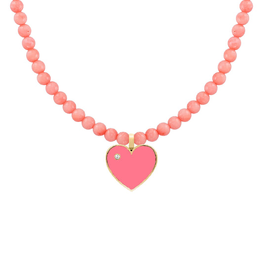 Beaded children’s necklace featuring round pink beads and a gold heart pendant with pink enamel and a small diamond accent.