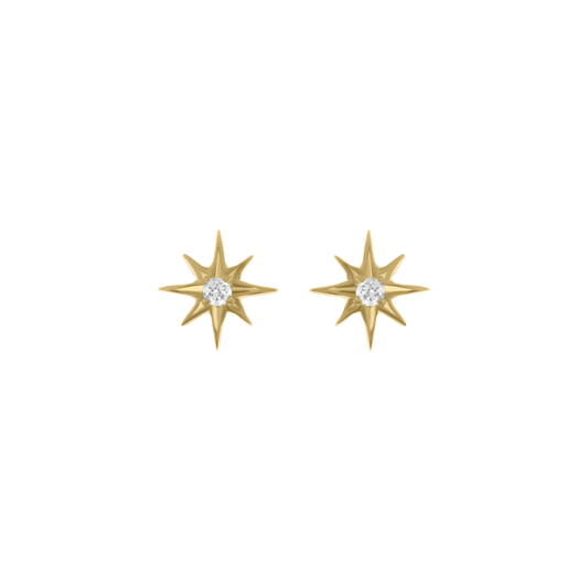Pair of gold starburst-shaped stud earrings with eight points, each featuring a central round diamond, displayed on a transparent background.