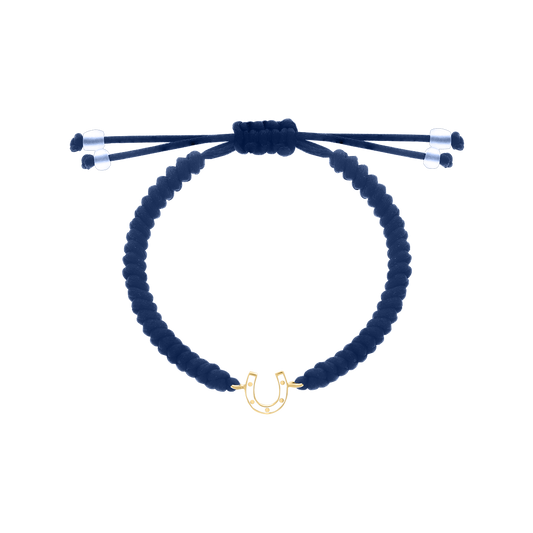 Blue cord bracelet with yellow gold horseshoe charm