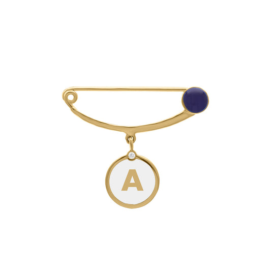 Gold safety pin brooch featuring a navy enamel accent and a dangling round charm with the letter “A” in gold and a small diamond detail, designed for babies.