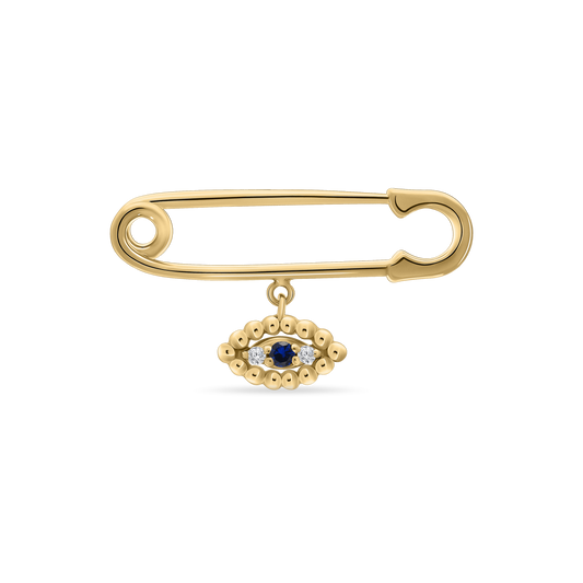 A polished 18K yellow-gold safety-pin brooch (baby pin style) with a dangling evil-eye charm—an oval of gold beads encircling a central blue sapphire flanked by two small diamonds—shown on a transparent background.