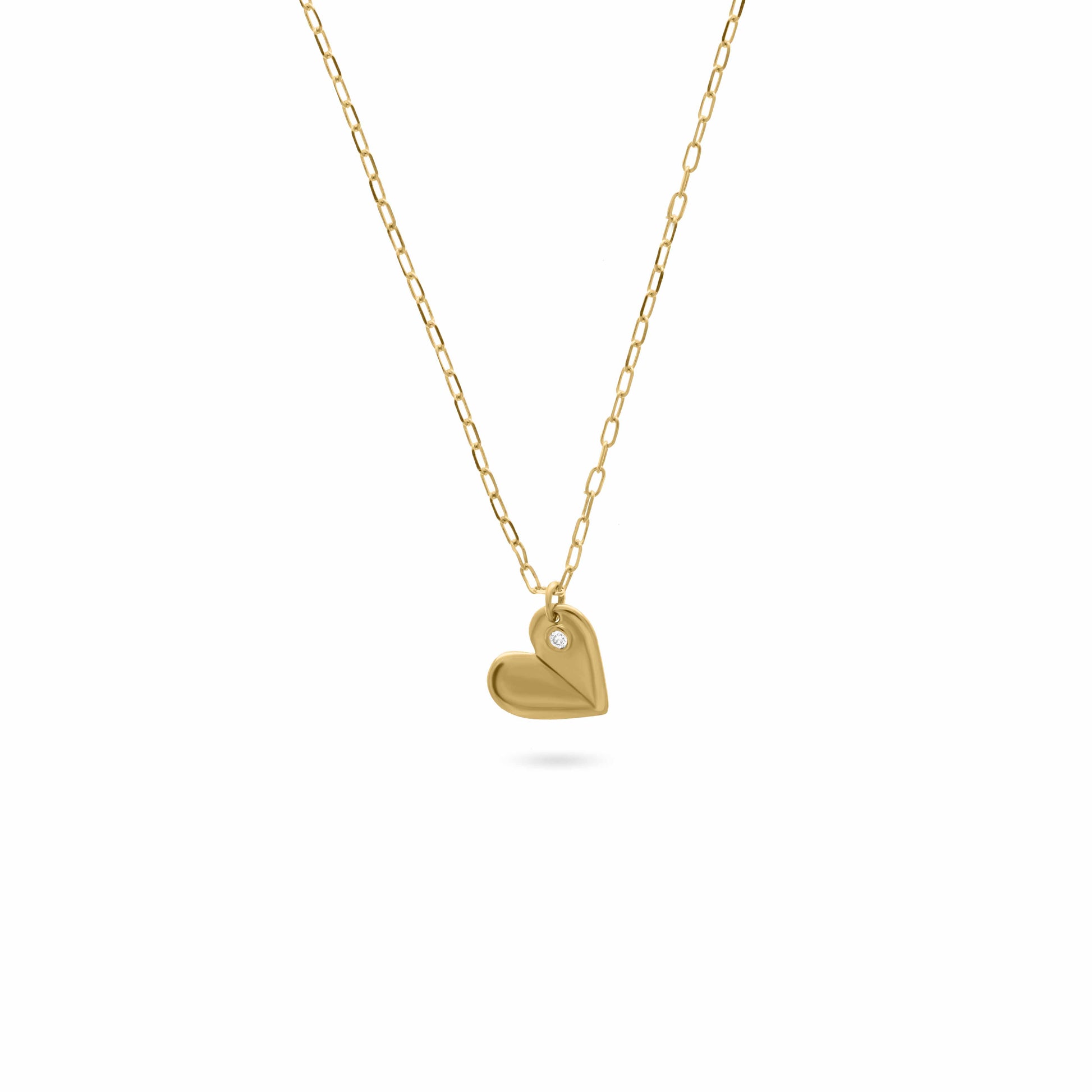 Gold necklace with a folded heart-shaped pendant featuring a small diamond, displayed on a white background.