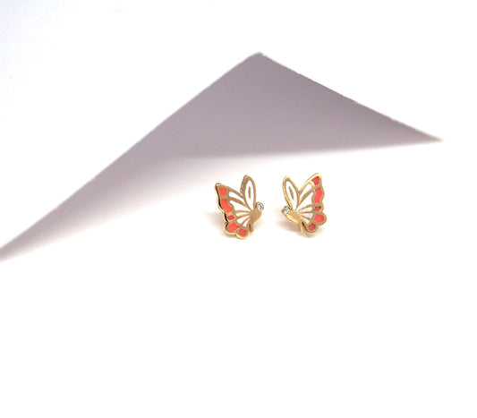 Pair of pink and gold butterfly earrings with diamonds displayed under soft lighting