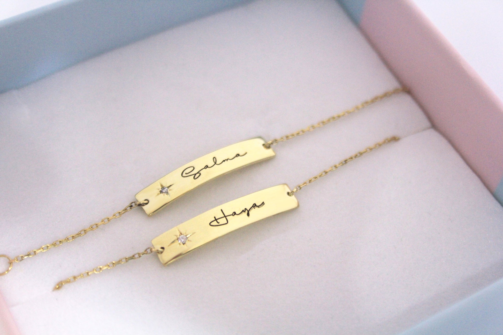Gold inscription diamond bracelet with personalized engraved names and star detail