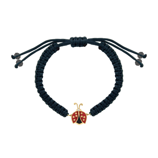 Dark blue cord bracelet featuring a red enamel ladybug charm with a small diamond accent, adjustable fit.
