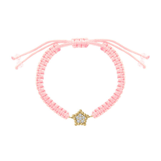 Pink woven cord bracelet featuring a gold star charm set with small diamonds, adjustable with pink bead-tipped ties.