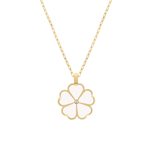 Gold necklace with a white enamel four-leaf clover pendant featuring a central diamond, displayed on a transparent background.