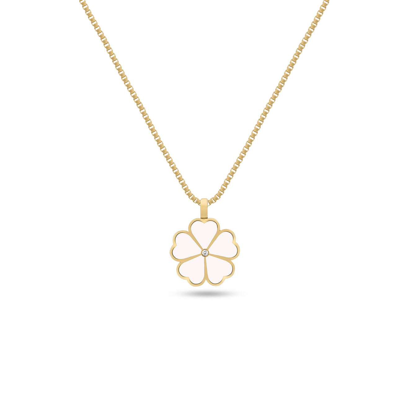Close-up of a white enamel four-leaf clover pendant with a diamond center on a gold chain, set against a white background.