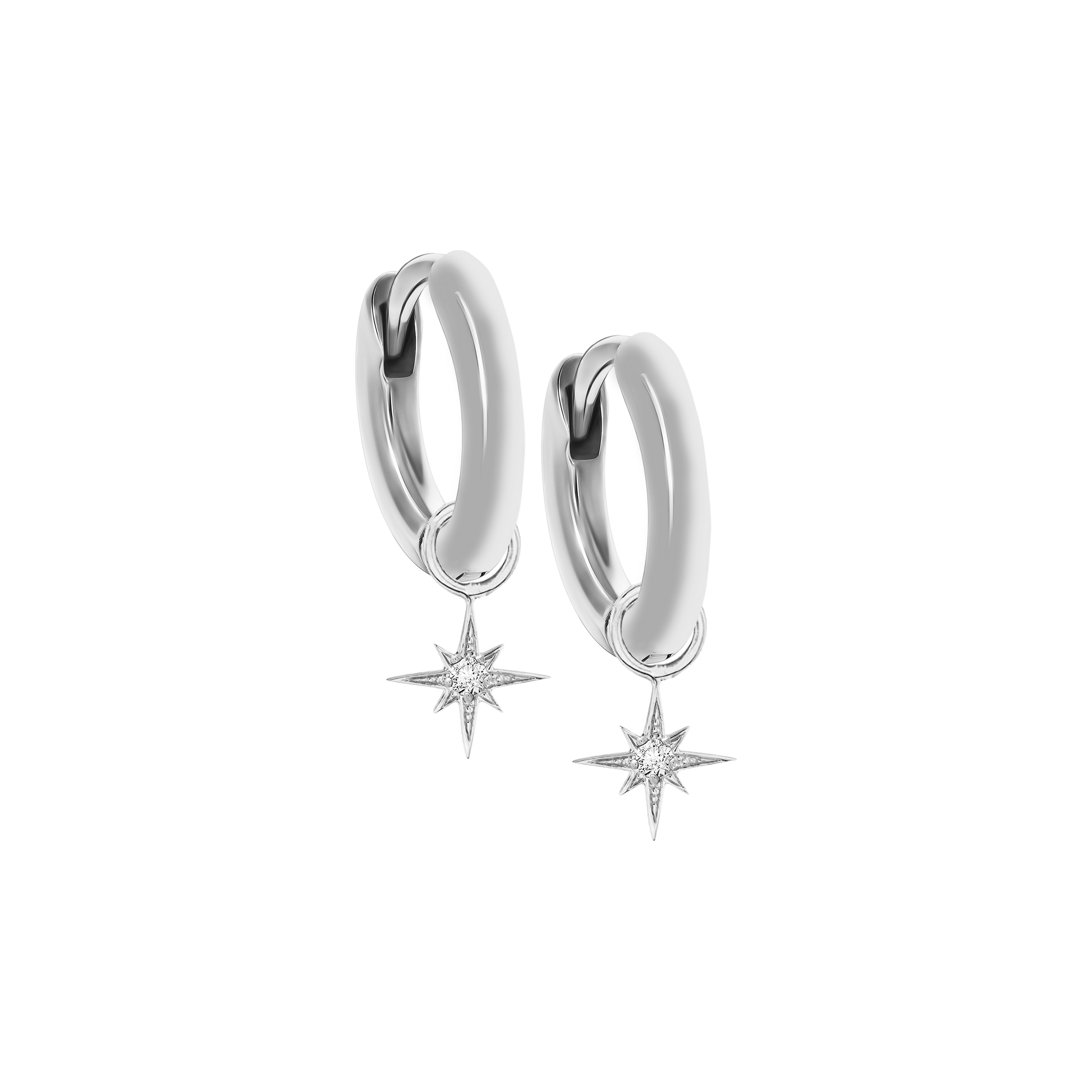 A pair of 18K white-gold mini hoop earrings, each hoop suspending a small eight-point star charm set with a single round brilliant-cut diamond at its center, shown side by side on a transparent background.
