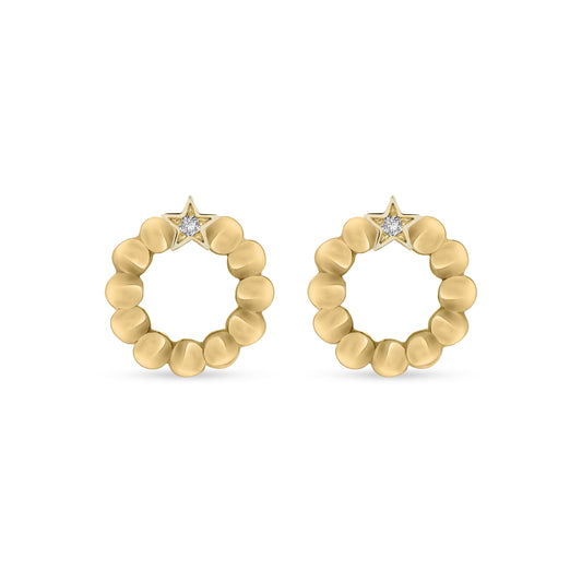 A pair of 18K yellow-gold Once Upon a Wish stud earrings: circular scalloped-bead hoops topped with a tiny star motif set with a single round brilliant-cut diamond, shown side by side on a transparent background.”