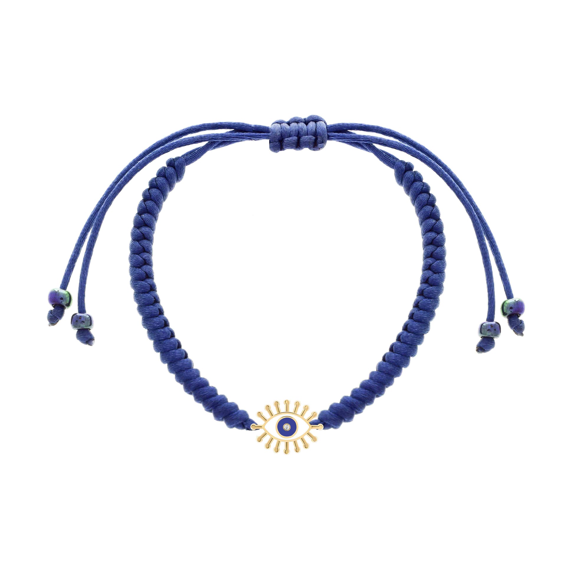 Adjustable navy blue cord bracelet featuring a gold evil eye charm with radiant lashes, a blue enamel center, and a tiny diamond.