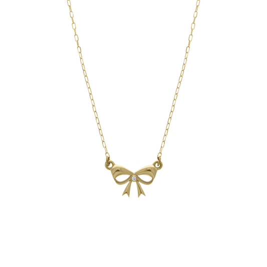 Gold necklace featuring a delicate bow-shaped pendant with a single diamond at the center, displayed on a transparent background.