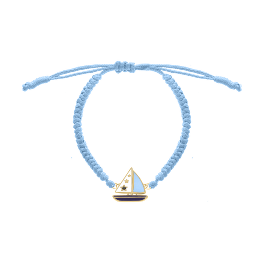 Light blue cord bracelet with yellow gold sailboat charm and blue enamel details