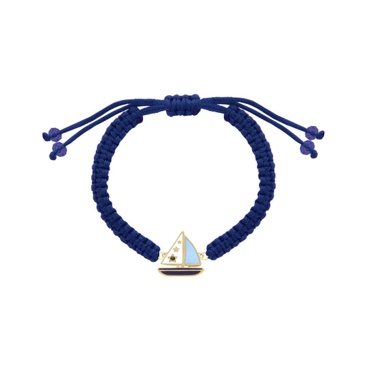 Navy cord bracelet with yellow gold sailboat charm and blue enamel details