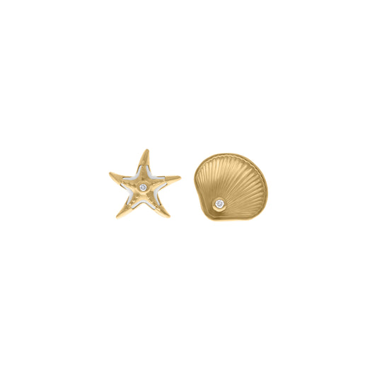 Mismatched gold stud earrings featuring a starfish with white enamel accents and a seashell, each with a small diamond in the center, displayed on a white background.