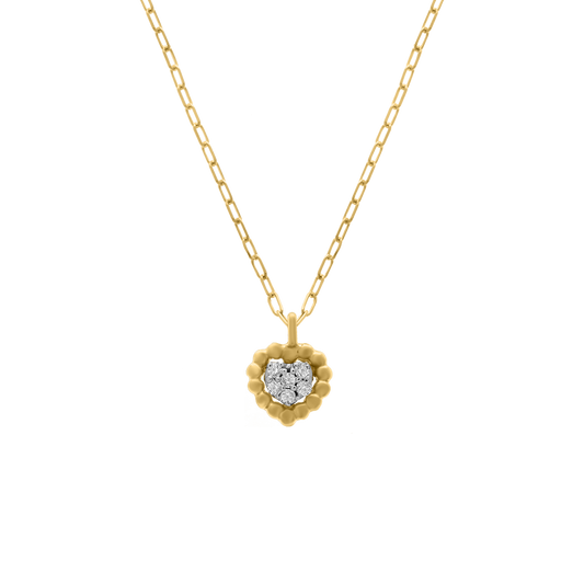 A studio shot of an 18K yellow-gold heart pendant necklace on a transparent background: a scalloped gold-bead heart frame encircling a cluster of round brilliant-cut diamonds, suspended from a fine paper-clip chain.