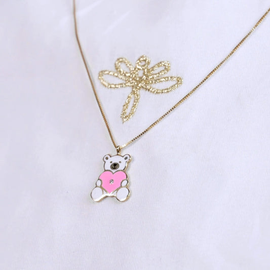 Necklace with a bear pendant holding a pink heart on a white background