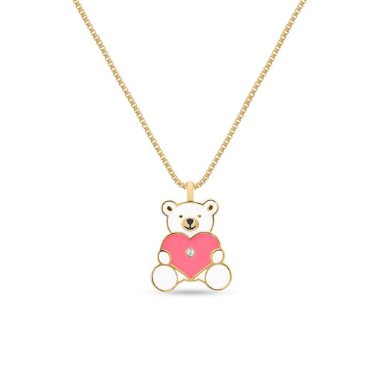 A gold teddy bear necklace with a pink enamel heart and a sparkling diamond